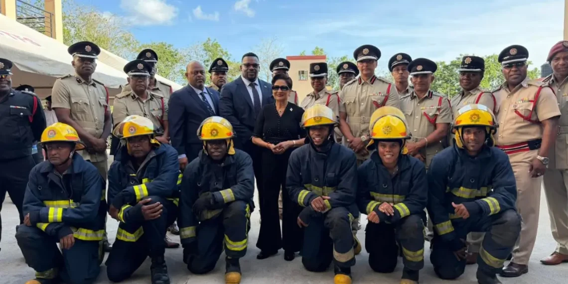 Trinidad fire service expansion photo shows Kamla Persad-Bissessar with firefighters