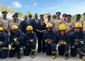 Trinidad fire service expansion photo shows Kamla Persad-Bissessar with firefighters