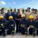 Trinidad fire service expansion photo shows Kamla Persad-Bissessar with firefighters