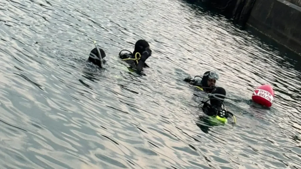 Royal Saint Lucia Police Force Marine Unit divers conduct underwater sweeps during the Taiwan Naval Visit in St Lucia to secure visiting warships.