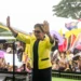 Kamla Persad-Bissessar raises both hands before supporters at a Trinidad rally as a letter to the editor addresses a Kamla Persad-Bissessar smear campaign.
