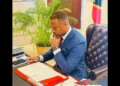 Hon Mark Brantley, Premier of Nevis, reviews documents at his desk ahead of commentary on the CARICOM dispute