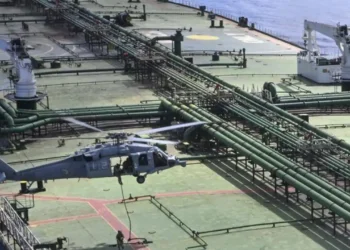 US Navy helicopter hovers over the deck of the sanctioned tanker M/T Majestic X during a maritime boarding operation in the Indian Ocean.