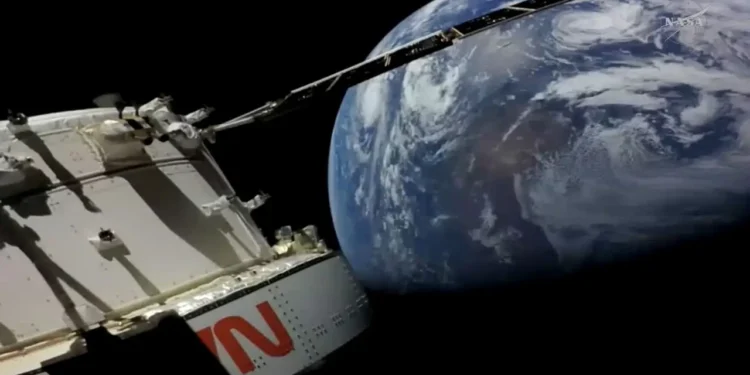 Artemis II Moon mission Orion spacecraft with Earth in background during NASA’s record-breaking crewed flight