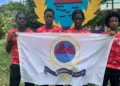 St Lucia Penn Relays athletes from St. Mary’s College holding school flag