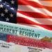 US Permanent Resident green card and immigrant visa documents on American flag background
