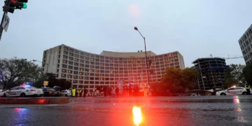 Police vehicles with emergency lights outside the Washington Hilton after a shooting at the White House Correspondents Dinner on April 25 2026