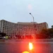 Police vehicles with emergency lights outside the Washington Hilton after a shooting at the White House Correspondents Dinner on April 25 2026
