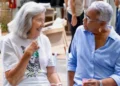 Two cancer survivors share a moment of connection at the Health City Cayman Islands Cancer Survivors Wellness Retreat.