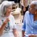 Two cancer survivors share a moment of connection at the Health City Cayman Islands Cancer Survivors Wellness Retreat.