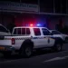 Royal St Lucia Police Force vehicle responding to a Castries parking lot shooting at night.