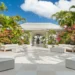 Open-air courtyard with tropical landscaping at Spice Island Beach Resort on Grand Anse Beach, Grenada.