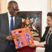Pierre Persad-Bissessar talks open with ceremonial gift exchange at the Diplomatic Centre in Port of Spain, April 30, 2026, with Saint Lucia and Trinidad and Tobago flags in the background.