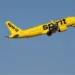 A Spirit Airlines aircraft climbs after takeoff against a clear blue sky, May 2026.