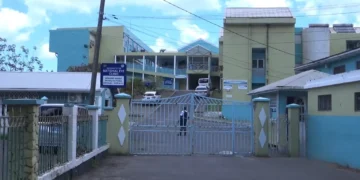 Closed gate of the St. Lucia Polyclinic and National Eye Clinic compound in Castries, May 2026.