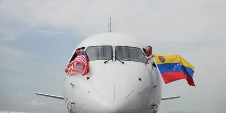 US-Venezuela flights resume as American Airlines pilots display US and Venezuelan flags from the cockpit, April 30, 2026.