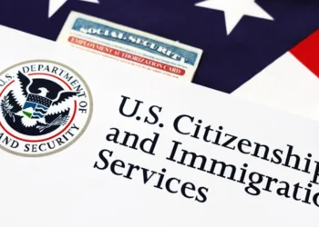 USCIS immigration documents and Social Security card related to new Adjustment of Status policy changes