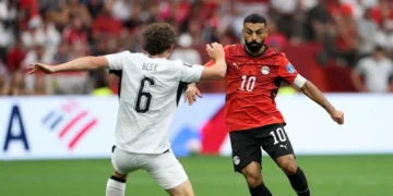Egypt makes history at the World Cup 2026 as number 10 drives past New Zealand defender Bell in Vancouver