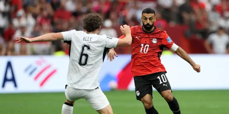 Egypt makes history at the World Cup 2026 as number 10 drives past New Zealand defender Bell in Vancouver