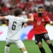 Egypt makes history at the World Cup 2026 as number 10 drives past New Zealand defender Bell in Vancouver