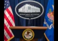 Department of Justice podium during announcement of the Health Care Fraud Takedown that charged 455 defendants in alleged $6.5 billion fraud schemes.
