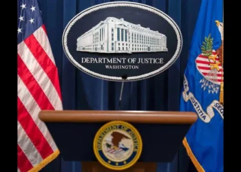 Department of Justice podium during announcement of the Health Care Fraud Takedown that charged 455 defendants in alleged $6.5 billion fraud schemes.