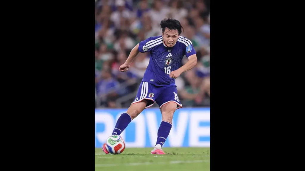 Ayase Ueda of Japan strikes the ball during Japan's 4-0 victory over Tunisia at the FIFA World Cup 2026.