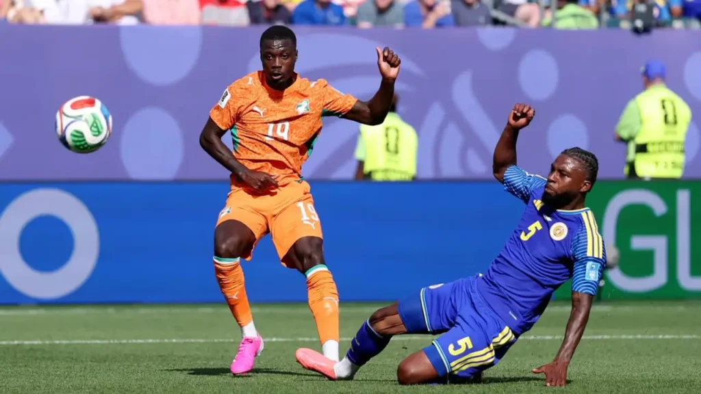 Nicolas Pépé of Côte d'Ivoire drives past a Curaçao defender during the FIFA World Cup 2026 Group E match