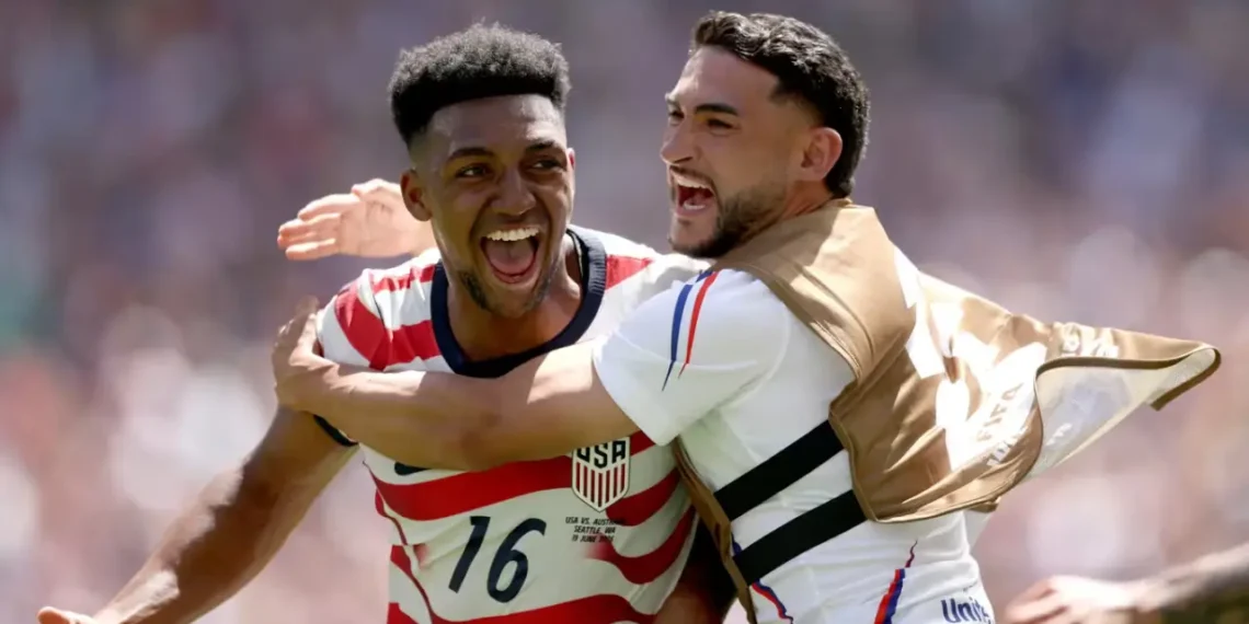 United States Advances to the World Cup knockout stage as USA players celebrate their 2-0 win over Australia in Seattle.