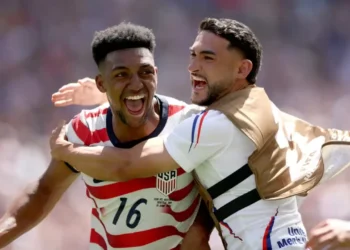 United States Advances to the World Cup knockout stage as USA players celebrate their 2-0 win over Australia in Seattle.