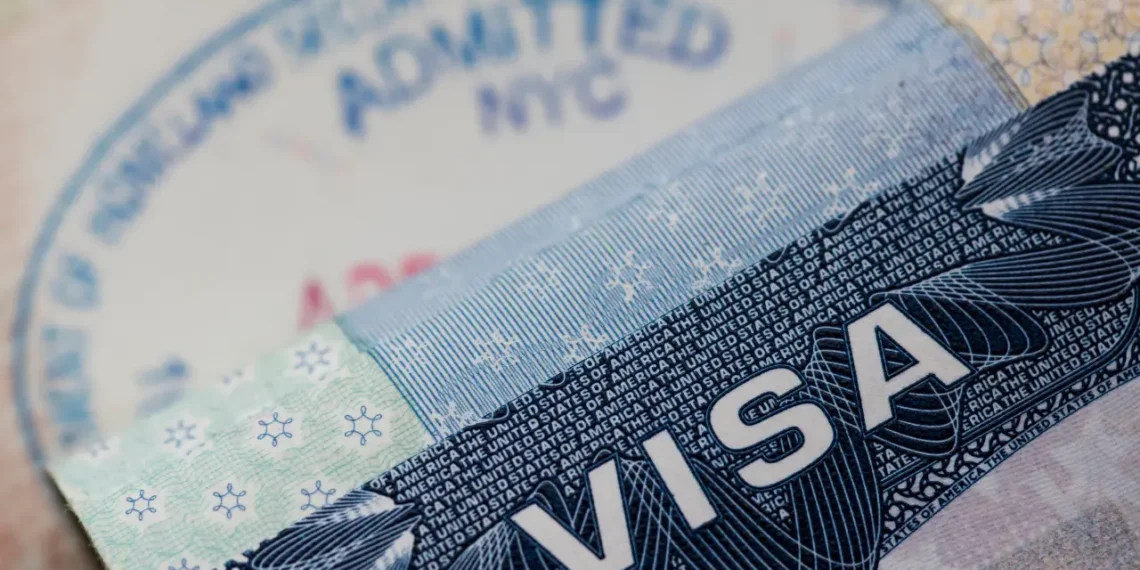 A U.S. visa document and entry stamp illustrating U.S. visa revocations tied to fraud and Medicaid abuse