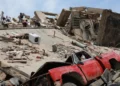 Venezuela earthquake crushed vehicle buried under collapsed building rubble in La Guaira June 25 2026