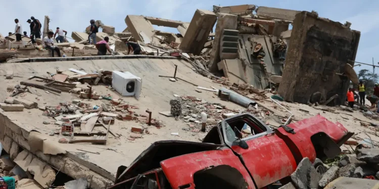 Venezuela earthquake crushed vehicle buried under collapsed building rubble in La Guaira June 25 2026