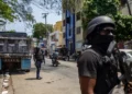 Haiti security crisis as armed personnel patrol a street in Port-au-Prince