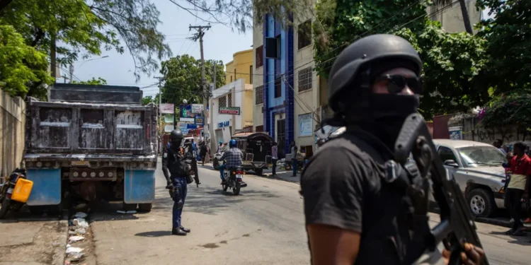 Haiti security crisis as armed personnel patrol a street in Port-au-Prince