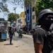 Haiti security crisis as armed personnel patrol a street in Port-au-Prince