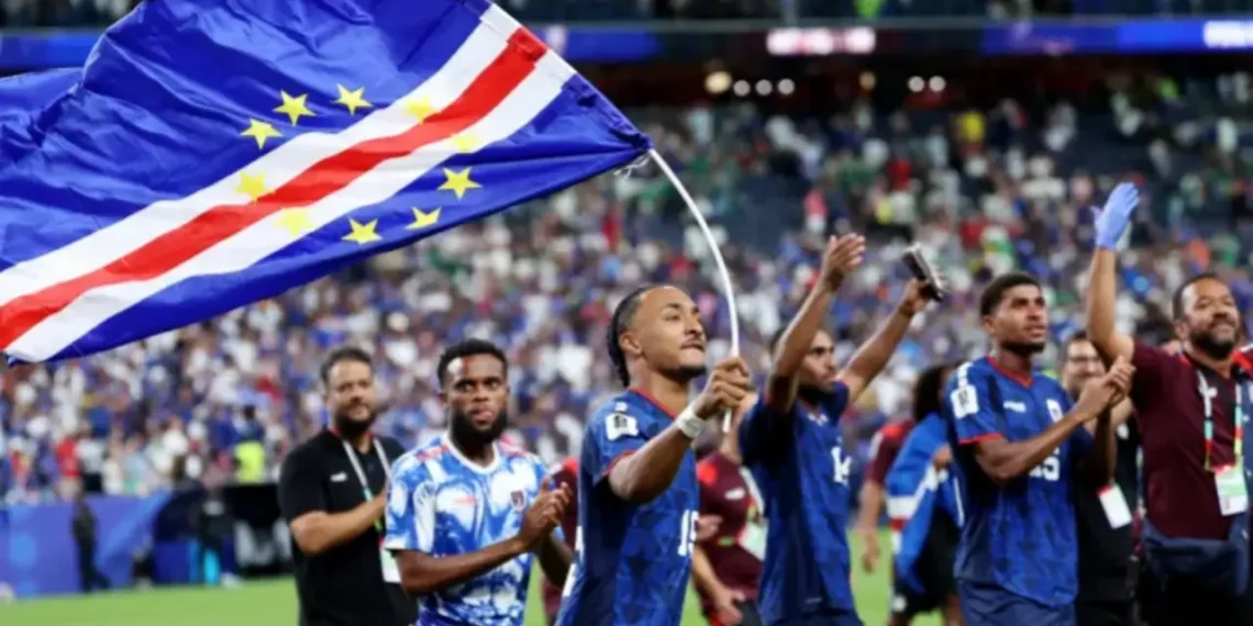 Cabo Verde players and staff celebrate on the field after qualifying for the World Cup 2026 Round of 32.