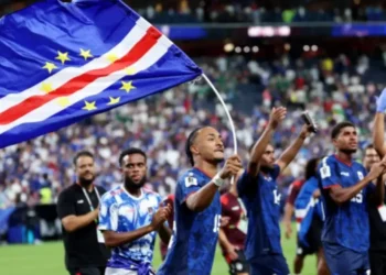 Cabo Verde players and staff celebrate on the field after qualifying for the World Cup 2026 Round of 32.