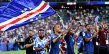 Cabo Verde players and staff celebrate on the field after qualifying for the World Cup 2026 Round of 32.