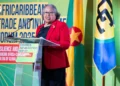Dr Carla Barnett, whose CARICOM Secretary-General reappointment was referred to the CCJ, speaks at a podium