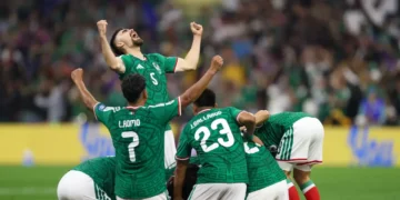 Mexico players celebrate their World Cup knockout drought win over Ecuador at Estadio Azteca.