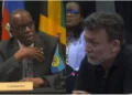 Split image of Prime Minister Philip J. Pierre seated at a CARICOM chairman's desk and Al Jazeera correspondent Josh Rushing speaking at a microphone.