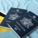 Saint Lucia passports on the national flag, symbolizing the St Lucia CBI Programme phase-out ordered by the EU
