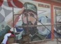 US State Department Cuba report featured image showing a Fidel Castro mural in Cuba.