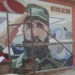 US State Department Cuba report featured image showing a Fidel Castro mural in Cuba.