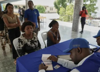 Haiti voter registration officials process applicants in Port-au-Prince