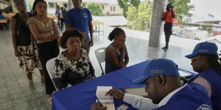Haiti voter registration officials process applicants in Port-au-Prince