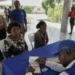Haiti voter registration officials process applicants in Port-au-Prince