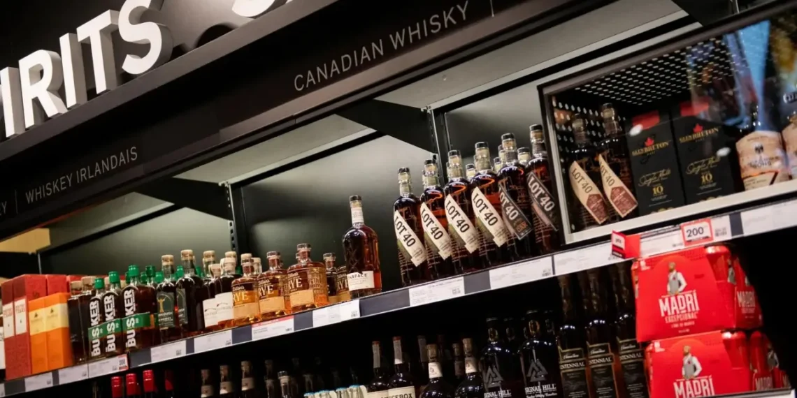 Canadian whisky bottles on store shelves, illustrating the US ban on Canadian imports.