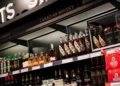 Canadian whisky bottles on store shelves, illustrating the US ban on Canadian imports.